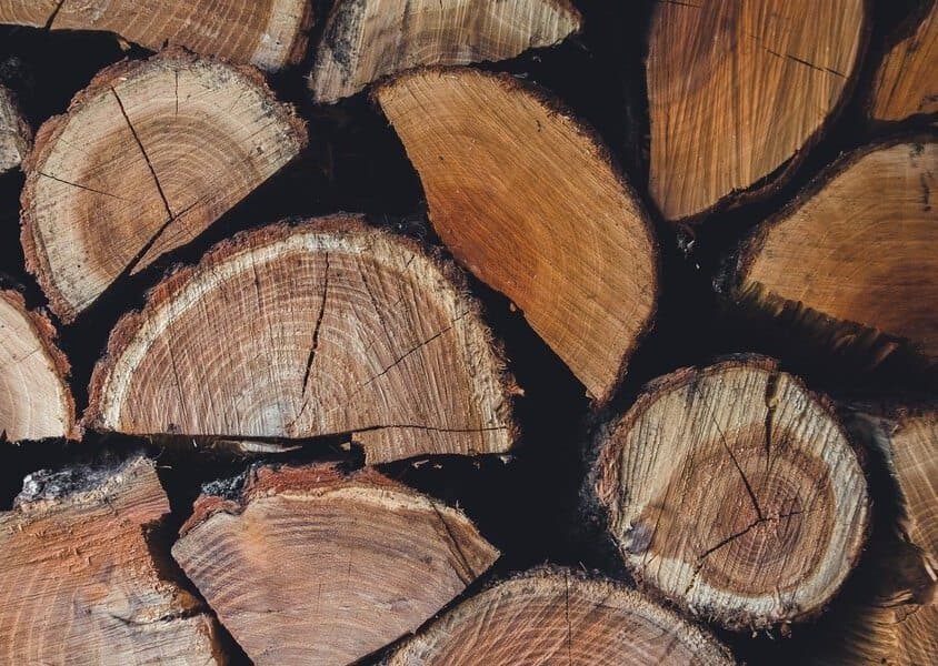 Seasoned timber stacked in the workshop yard